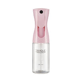 TANGLE TEEZER travel-size bottle in Millennial Pink for quick detangling between washes.
