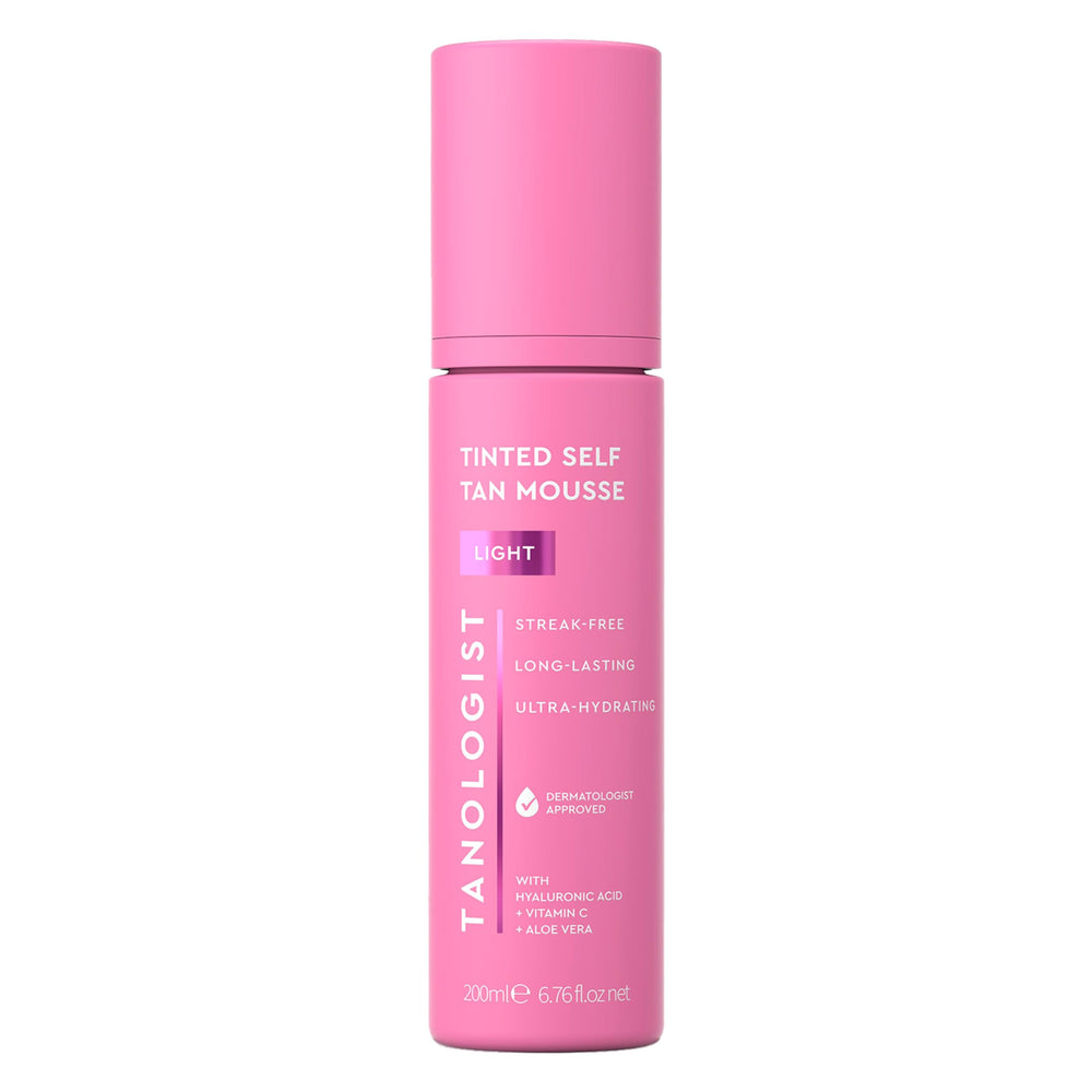Tanologist Light Self Tan Mousse tube close-up with color guide for even application.