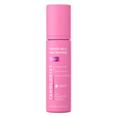 Tanologist Light Self Tan Mousse tube close-up with color guide for even application.