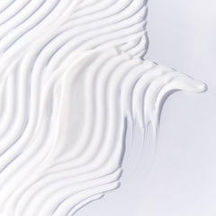 Tata Harper Water-Lock Moisturizer gel-cream texture swirl indicating lightweight hydration and quick absorption.