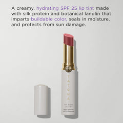 TATCHA Kissu Lip Tint Plum Blossom compact close-up emphasizes glossy finish and smooth texture.