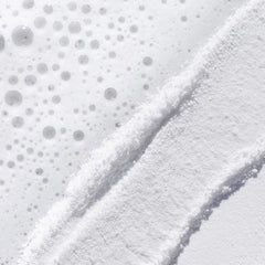 TATCHA Rice Polish Classic damp-face application shows non-abrasive daily ritual.