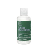 Tea Tree defining gel bottle front shows sleek packaging for frizz control.