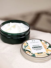 The Body Shop almond milk body butter applied on arm demonstrates quick absorption and soothing feel.