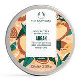 The Body Shop Argan Body Butter jar closeup showing creamy texture for long-lasting moisture