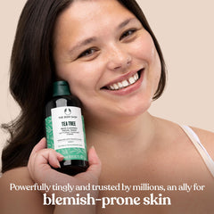 The Body Shop Tea Tree Skin Clearing Facial Wash texture close-up, illustrating gel cleanse that helps purify pores.