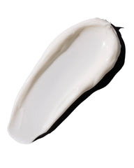 The Body Shop Vitamin E Intense Moisturizer hands applying cream for smooth finish.