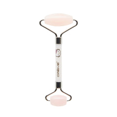 The Crème Shop Hello Kitty Love Quartz Roller, closeup on face, boosts absorption and radiant skin.