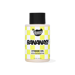 The Doux Bananas Xtreme Hold bottle pour supports long-lasting hold on defined curls.