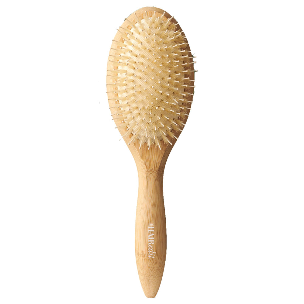 The Hair Edit Glossifier bamboo brush with boar bristles for smoothing frizz and boosting shine.