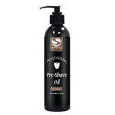 The Henna Guys pre-shave oil bottle in sandalwood scent for smoother shaves.