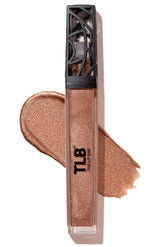 The Lip Bar Goddess gloss bottle closeup shows golden bronze shimmer with lasting moisture.