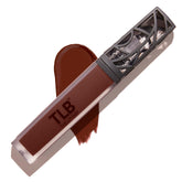 The Lip Bar Savage bottle close-up showing long-lasting chocolate-red shade.