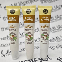 The Make-Up Artist Project Shea Butter Lip Therapy jar closeup highlights jojoba oil benefits and smooth results.