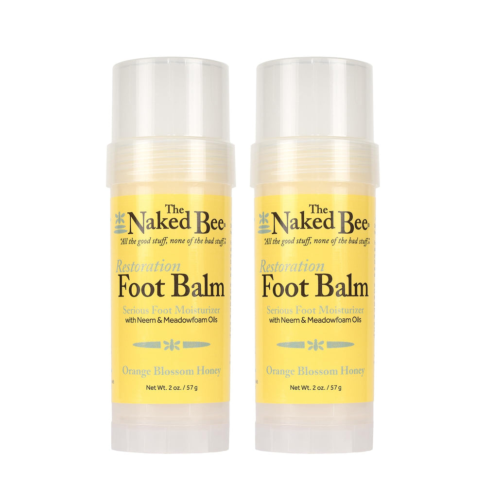 The Naked Bee orange-blossom-honey foot balm roll-on application for smooth, moisturized feet.