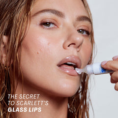 The Outset Lip Oasis Glossy Treatment applicator-ready image demonstrates easy application