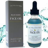 The Yellow Bird Balancing Blue Tansy Face Oil bottle showcases vegan, antioxidant-rich formula for clear skin.