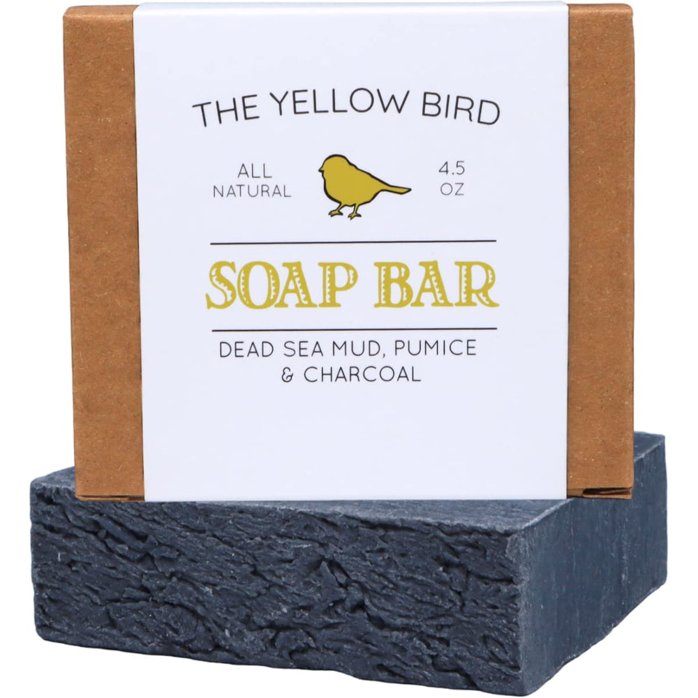 The Yellow Bird Dead Sea Mud Soap Bar shows pumice exfoliation for smoother skin.