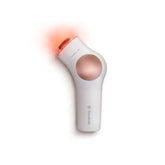 TheraFace PRO white device resting on skin for a calming facial massage session