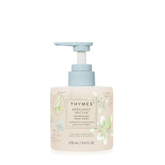 Thymes Nourishing Hand Wash bottle on sink for daily refreshing cleansing.