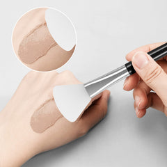 Tifanso brush in hand applying clay mask for a spa-like routine
