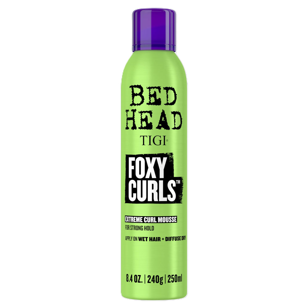TIGI Bed Head Foxy Curls Mousse bottle front highlighting strong hold and defined curls.