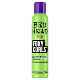TIGI Bed Head Foxy Curls Mousse bottle front highlighting strong hold and defined curls.