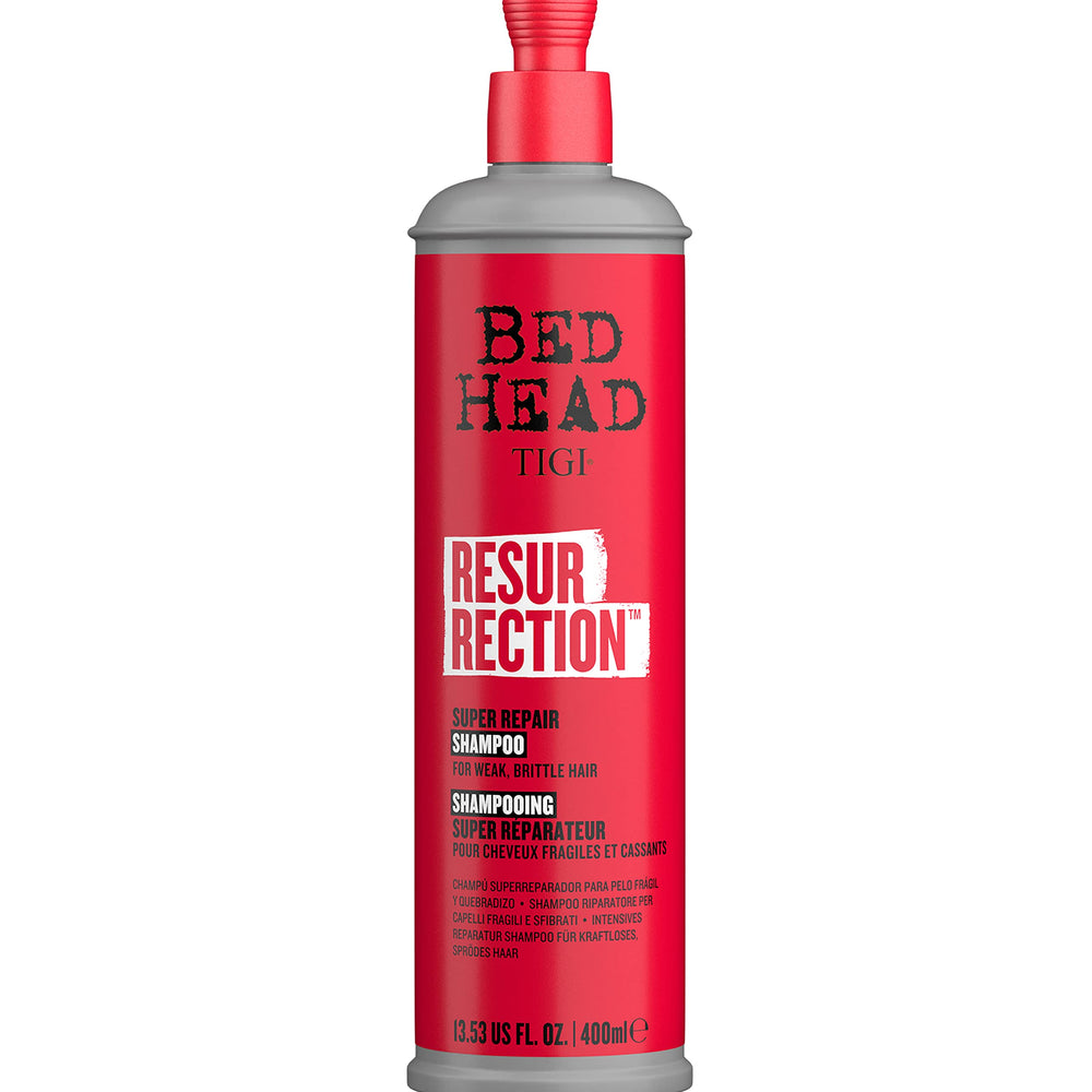 TIGI Bed Head Resurrection Shampoo bottle pour showing damage repair in action for stronger hair.