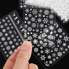 Tiwnefua nails with snowflake decals highlight elegant winter style on natural nails.