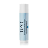 TiZO Lip Protection tinted bottle showing mineral sunscreen on lips.