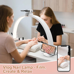 TONYFUL Half Moon Light with a 31-inch arch illuminating a wide work surface for tattoos and nails.