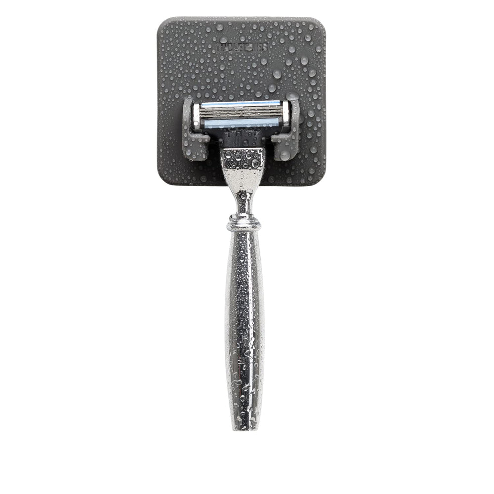 TOOLETRIES Mason Razor Holder front view shows secure silicone grip on a bathroom surface