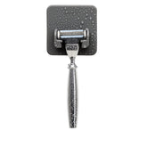 TOOLETRIES Mason Razor Holder front view shows secure silicone grip on a bathroom surface