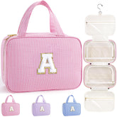 TOPEAST initial hanging toiletry bag pink for organized travel on the go.