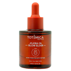 Totemica Jojoba Oil Glow Elixir bottle showing lightweight hydration for radiant skin.