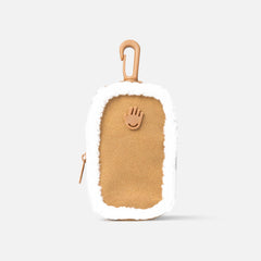 Touchland limited edition vegan shearling touchette pouch shows plush texture and portable hand sanitizer storage