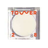 Tower 28 SuperDew Balm compact showing creamy glow for quick highlighting.