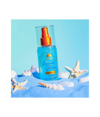 Tree Hut Ocean Glow Fragrance Mist bottle emphasizes long-lasting amber-tropical scent.