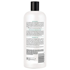 Tresemme conditioner texture close-up showing rich detangling moisture.