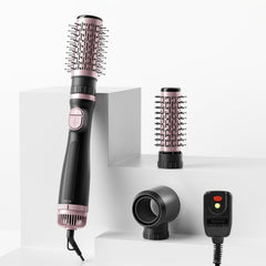 Tresses Touch blow dryer brush main unit in hand for fast, one-step styling.