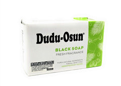Tropical Naturals Dudu Osun texture closeup highlighting earthy bar ideal for soothing skin.