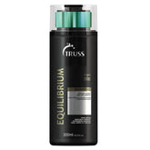 TRUSS Equilibrium bottle pours a hydrating cleanse for oily scalp and dry ends.