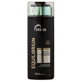TRUSS Equilibrium bottle pour demonstrates lightweight hydration for oily scalp.