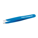 Tweezerman Mini Slant travel tweezers in Bahama Blue, closeup showing precise tips for brow shaping.