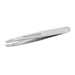 Tweezerman Mini Slant Tweezer close-up shows compact travel-friendly design.