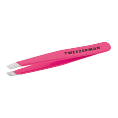 Tweezerman Mini Slant Tweezer neon pink closeup showing precise hand-filed tips for brow shaping