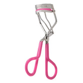 Tweezerman Neon Pink Comfort Grip Eyelash Curler open for base-to-tip curl delivering a wide-awake look.