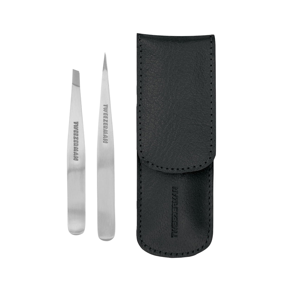 Tweezerman Petite Tweeze Set in black travel case for precise brow shaping on the go.