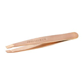 Tweezerman rose gold mini slant tweezer closeup for precise brow shaping