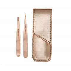 Tweezerman rose gold petite point tweezers—precise brow shaping for clean lines.